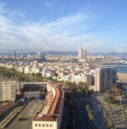 Cityscape against cloudy sky