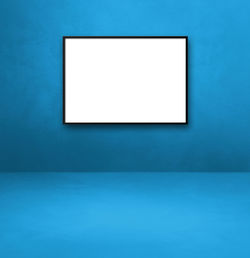 Low angle view of empty blue painted on wall