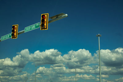 Low angle view of street light against sky