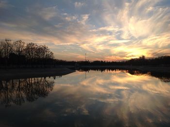 Scenic view of lake against sky during sunset