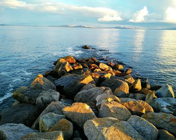 Scenic view of sea against cloudy sky