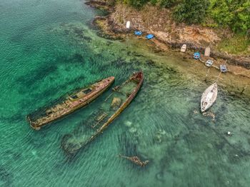 High angle view of boats on sea shore