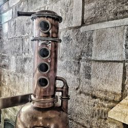 Close-up of old pipe against wall