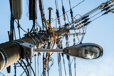 Low angle view of street light against sky