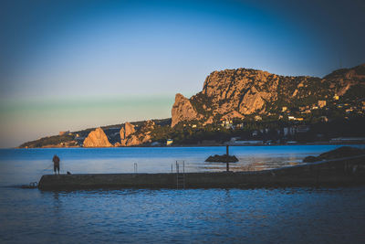 Scenic view of sea against clear blue sky