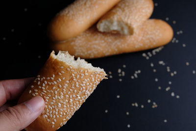 Close-up of hand holding baguettes