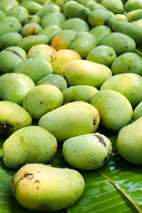 High angle view of mango for sale at market stall