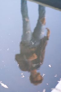 Reflection of people in lake