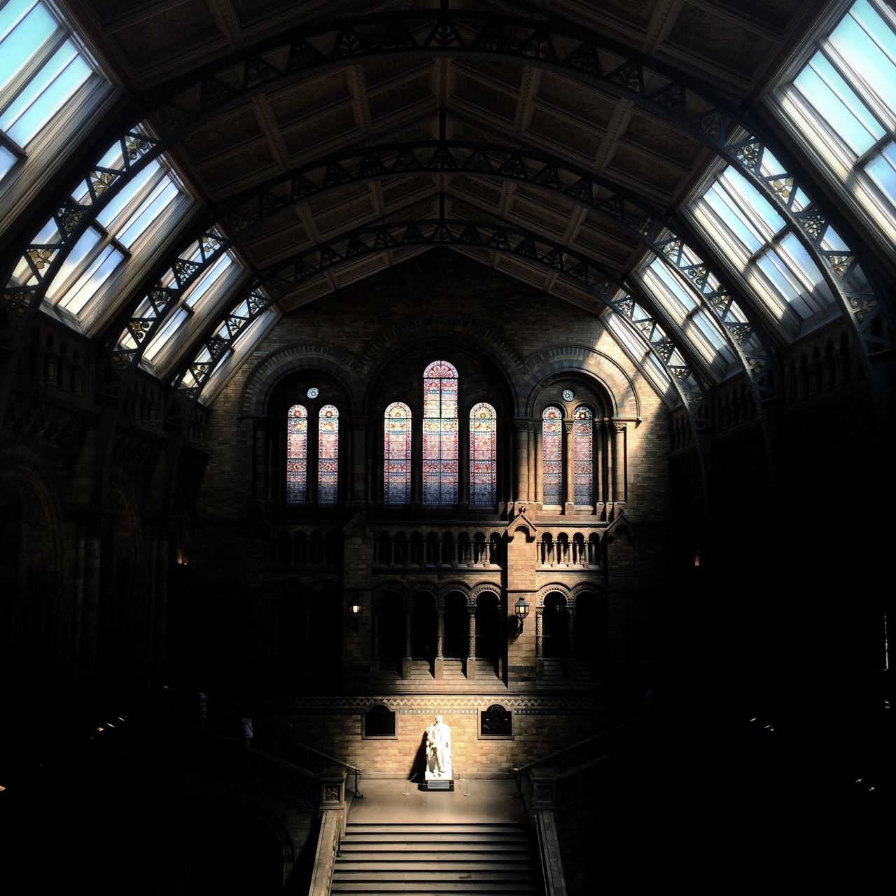 indoors, architecture, ceiling, built structure, arch, interior, window, incidental people, architectural column, flooring, glass - material, men, travel, railroad station, skylight, corridor, day, shopping mall, building