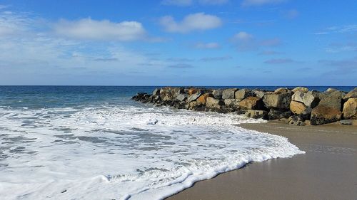 Scenic view of sea against blue sky