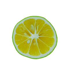 Close-up of lemon slice against white background