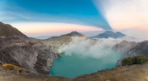 Panoramic view of volcanic landscape against sky during sunset