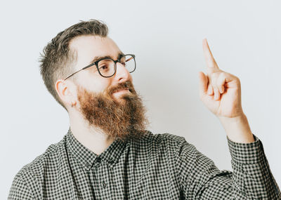 Portrait of young man against white background