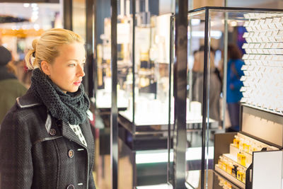 Woman looking away at store