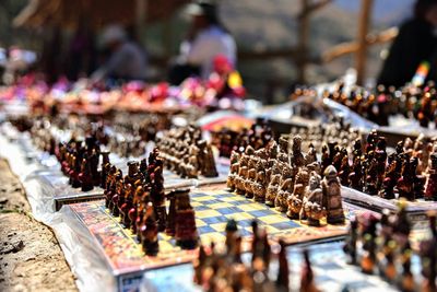 Close-up of figurines for sale at market