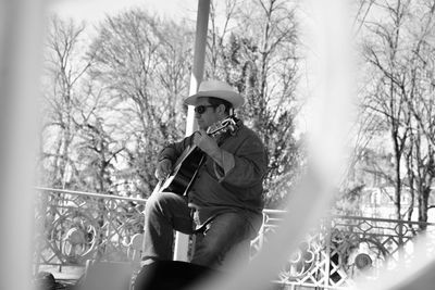 Low angle view of man playing guitar