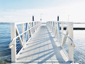 Pier over sea against sky