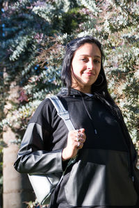 Beautiful brunette woman wearing backpack