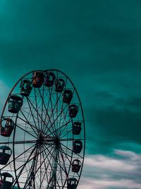 Low angle view of ferris wheel against sky