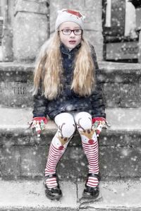 Portrait of young woman in snow