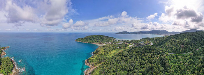 Panoramic view of sea and mountains against sky