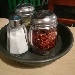 Close-up of glass of jar on table