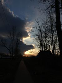 Silhouette bare trees against sky during sunset