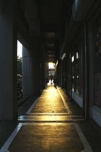 Empty corridor of illuminated building