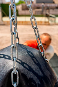 Close-up of swing in playground