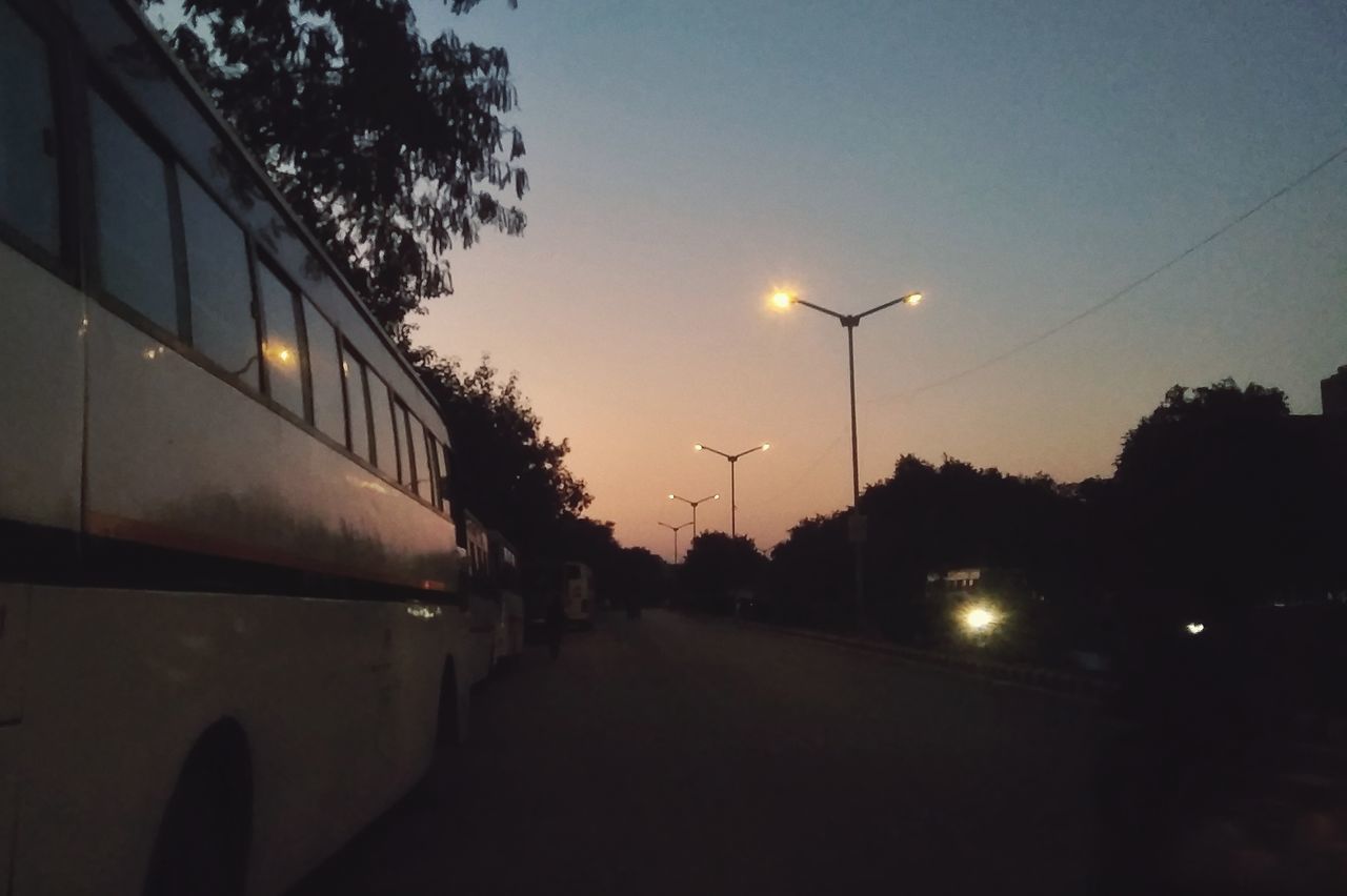 VIEW OF STREET LIGHTS AT SUNSET