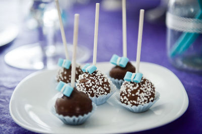 Close-up of cake pops in plate on table