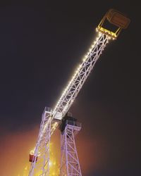 Low angle view of illuminated building at night