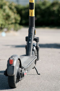 Close-up of bicycle parked on road