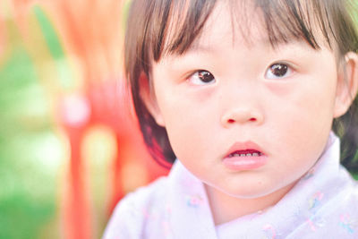 Close-up of cute boy looking away