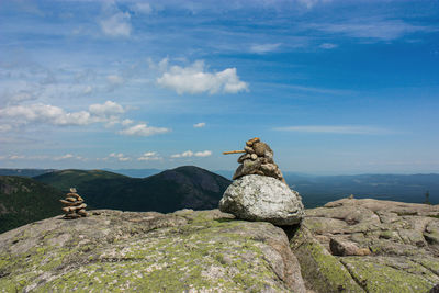 Rocks on mountain against sky