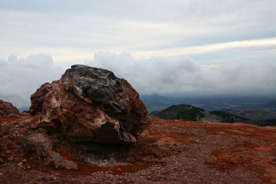 Rock formations on landscape against sky