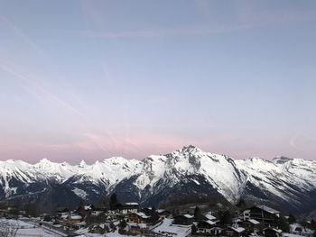 Scenic view of snowcapped mountains against sky