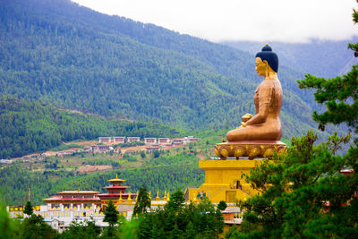 Buddha temple by mountains