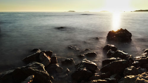 Scenic view of sea at sunset