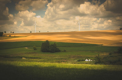 Scenic view of farm against sky