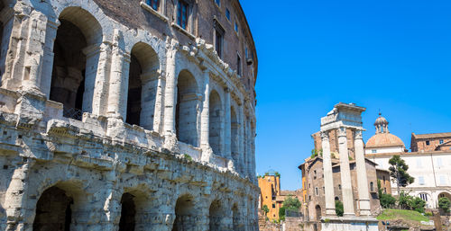 Low angle view of historic building against clear blue sky