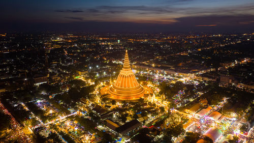 High angle view of illuminated buildings in city at night