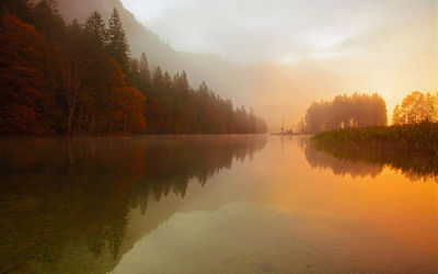 Scenic view of lake against sky during sunset