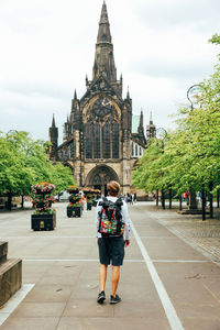 Rear view of woman walking on street