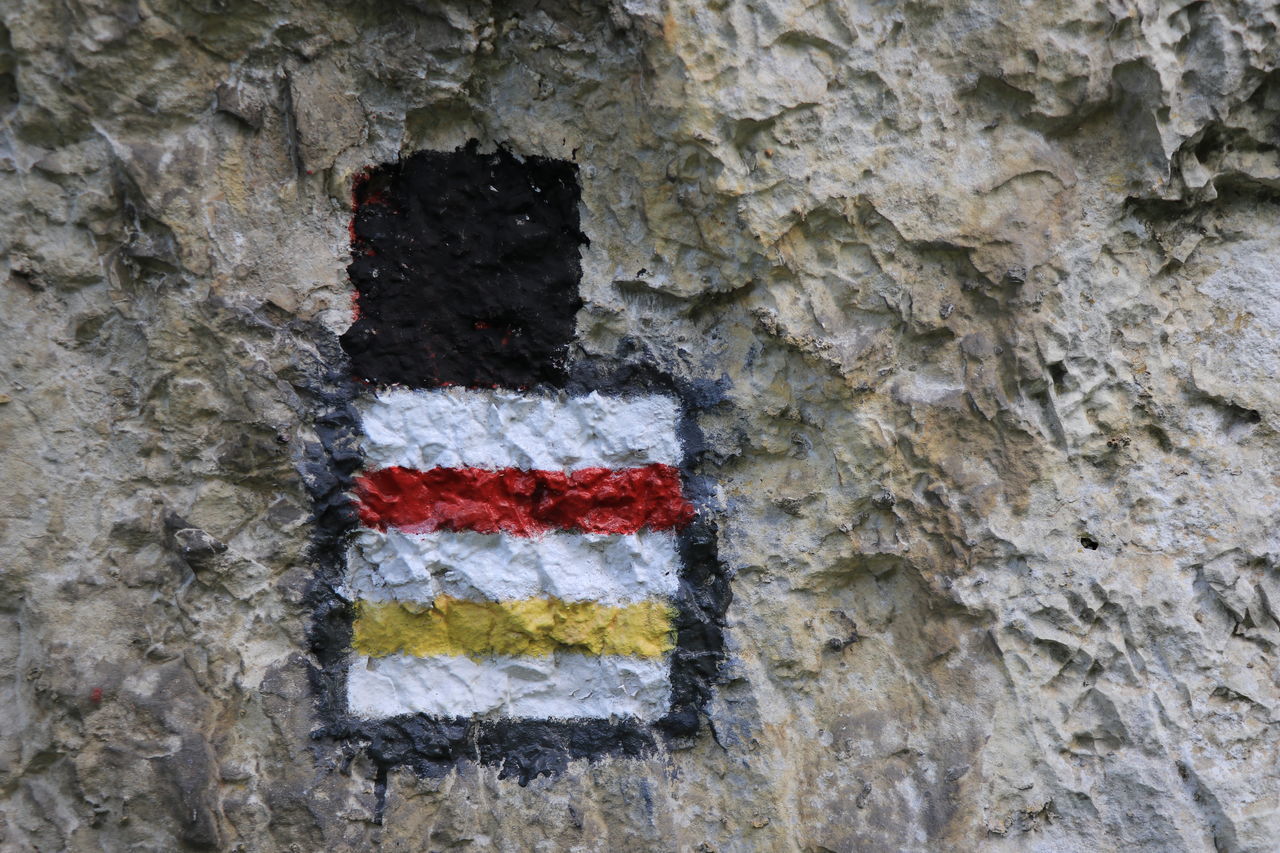 FULL FRAME SHOT OF STONE WALL WITH ROCKS