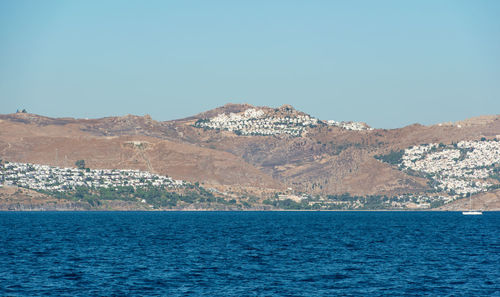 Aegean sea turkish coast and view of the port city of bodrum, boat trip from kos city to bodrum