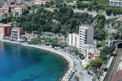 High angle view of swimming pool by buildings in city