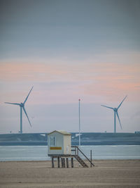 Scenic view of beach against sky during sunset