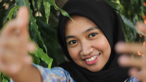 Portrait of smiling young woman