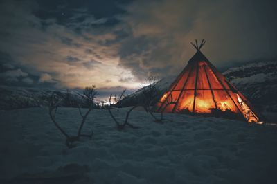 Tent on snow covered landscape